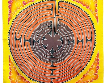 May include: A yellow silk scarf with a colorful mandala design. The mandala features a circular labyrinth pattern with orange, red, and brown colors. The scarf has a decorative border with stylized clouds.