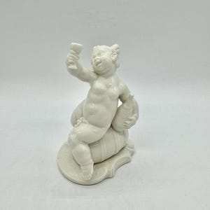 Nymphenburg - Blanc de Chine Cupid / Putto Cherub Four Seasons Autumn Bacchus Porcelain Figure by Bustelli / Model number 241