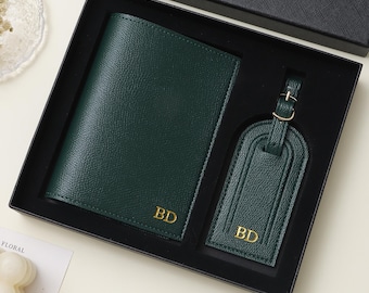 May include: A dark green passport holder and a matching luggage tag set presented in a black gift box. Both items feature a textured finish and the gold-embossed initials BD. The luggage tag includes a small gold-toned metal buckle strap.