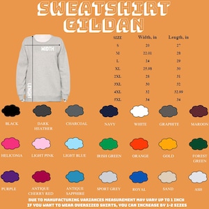 May include: A light gray Gildan sweatshirt with size and color options. The image displays a size chart with measurements in inches, and a color palette including black, navy, white, and more. The text reads "SWEATSHIRT GILDAN".