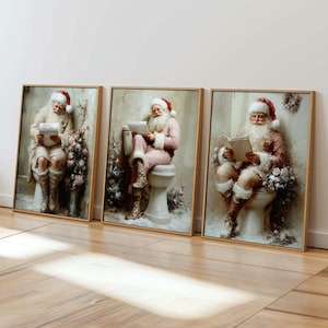 May include: Set of three framed art prints featuring Santa Claus in humorous poses. Each print depicts Santa seated on a toilet, reading. The artwork has a vintage, painterly style with soft colors and floral accents, creating a unique holiday theme.