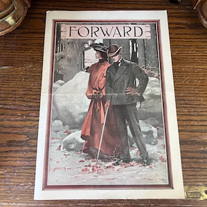 May include: Vintage print titled "FORWARD" featuring a man and woman in period attire. The woman wears a long red dress and hat, while the man is in a dark suit and bowler hat. The background shows a rocky landscape.