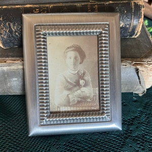 Antique photo in frame / young lady photograph