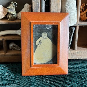Antique framed photo of baby
