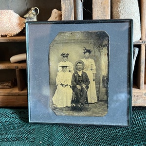 Vintage antique photograph with black plastic frame