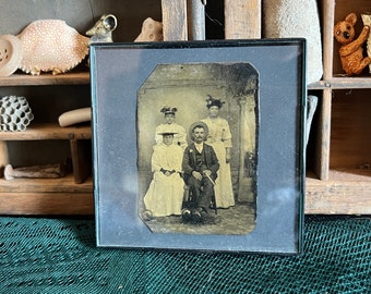 Vintage antique photograph with black plastic frame