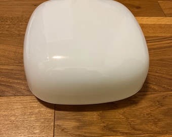 May include: A white, round, ceramic lampshade with a smooth, glossy finish.