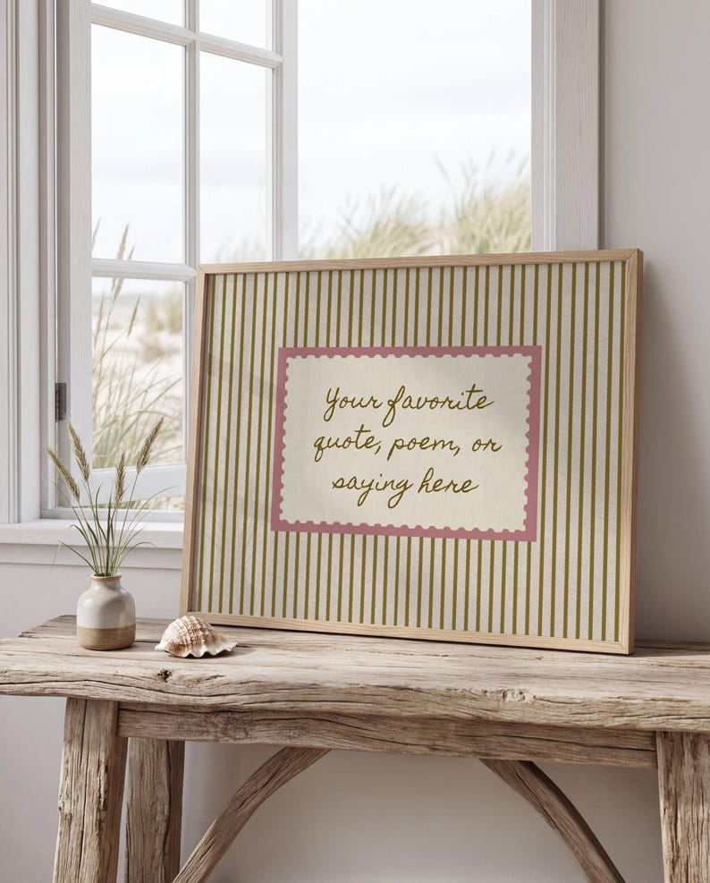 May include: A rectangular framed print featuring a vertical olive green striped pattern on a cream background. In the center, a cream-colored rectangle with a pink scalloped border contains the text: Your favorite quote, poem, or saying here.