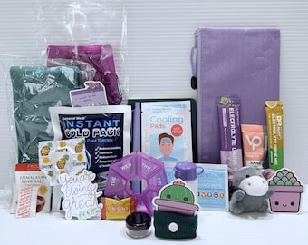 May include: A collection of self-care items, including a purple pill organizer, cooling pads, electrolyte drink mix, and a plush cow. Other items include a cold pack, Himalayan pink salt, and a small cactus decoration. The phrase "You're doing great" is also visible.