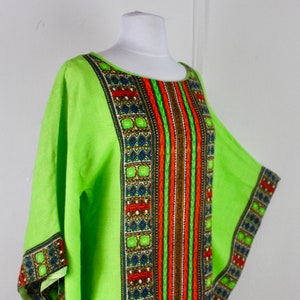 May include: A lime green kaftan with a geometric pattern in shades of red, orange, blue, and green.