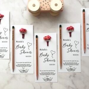 The seeded pencil is on a personalized card. There are also colorful flowers on the card.