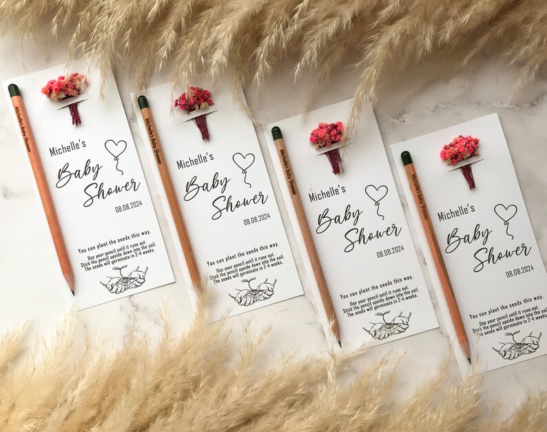 The seeded pencil is on a personalized card. There are also colorful flowers on the card.