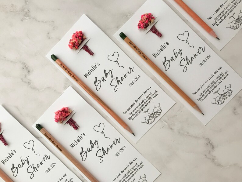 The seeded pencil is on a personalized card. There are also colorful flowers on the card.