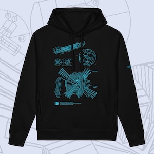 Könnte beinhalten: Ein schwarzer Kapuzenpullover mit einer leuchtend blauen technischen Blaupausengrafik auf der Vorderseite. Das Design zeigt mechanische Komponenten, darunter eine Feder und kreisförmige Strukturen, mit dem Text Mirror Fusion Test Facility.