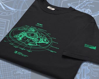 May include: Black t-shirt with a green schematic design of a jet engine and the word "SECRET" at the top. The text "BEAUTIFUL PUBLIC DATA" is printed on the sleeve. The shirt has a crew neck.