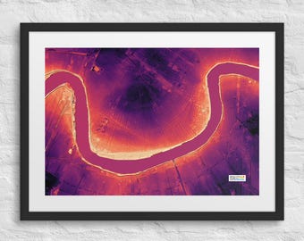 May include: A framed wall art print featuring an aerial view of a winding river in a gradient of purple, orange, and pink hues. The landscape shows a grid-like pattern of land surrounding the water. The text Beautiful Public Data is visible.
