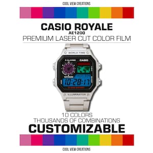 May include: A silver Casio Royale AE1200 digital watch with a black face and a blue digital display. The watch has a 10-year battery and an illuminator. The watch is customizable with 10 different colors.