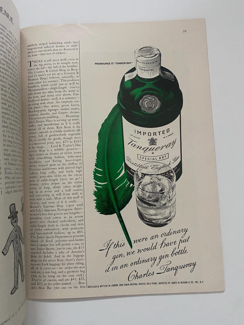May include: A green bottle of Tanqueray gin with a white label that reads "Imported Tanqueray Special Dry Distilled English Gin". The bottle is sitting on a white background with a green feather pen and a glass of gin.