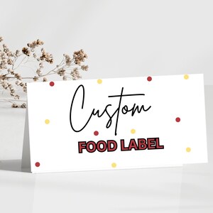 May include: White card with the text "Custom Food Label" in red and black lettering. The card is decorated with small red and yellow dots.