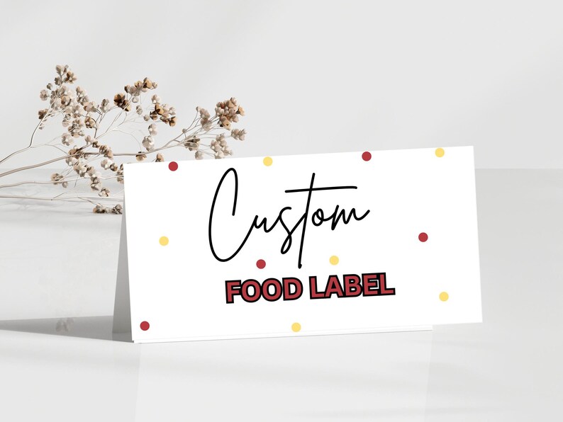 May include: White card with the text "Custom Food Label" in red and black lettering. The card is decorated with small red and yellow dots.
