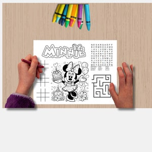 May include: A black and white coloring page featuring Minnie Mouse holding a birthday cake. The page includes a word search puzzle with the words "Birthday Cake", "Daisy", "Donald", "Goofy", "Happy", "Mickey", "Party", and "Pluto".