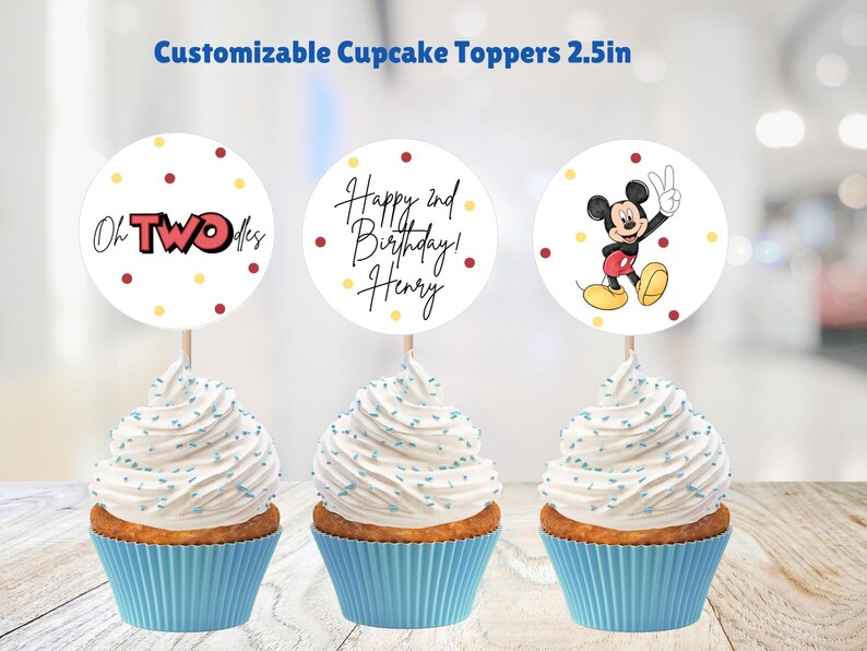 May include: Three cupcake toppers with 2.5 inch round circles. The first topper has a red and yellow design with the text "Oh TWO-dles". The second topper has a white circle with red and yellow dots and the text "Happy 2nd Birthday! Henry". The third topper has a white circle with red and yellow dots and a cartoon image of Mickey Mouse with the text "Mickey Mouse".