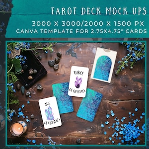 May include: Three tarot cards on a wooden surface with blue flowers and a candle. The cards are blue and purple with a crystal design and the text "Ace of Crystals" and "Three of Crystals".