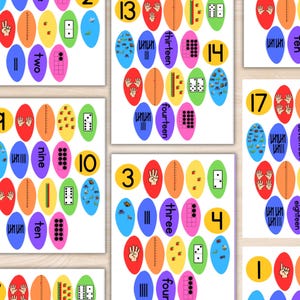 May include: Educational flashcards displaying numbers 1 to 18, each with a different colour. The cards feature number words, dots, hand gestures, and other symbols to help with number recognition and counting skills for children.