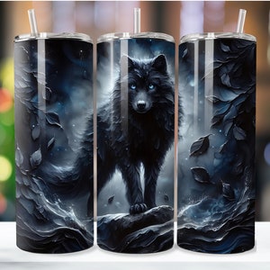 May include: Three stainless steel tumblers with a black wolf design. The wolf is standing in a dark forest with blue and white accents. The tumblers are perfect for keeping drinks cold or hot.