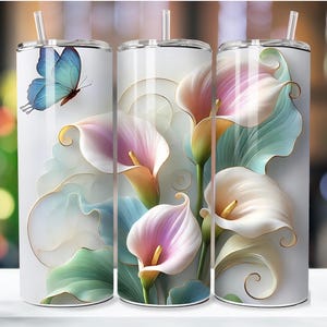 May include: Three stainless steel tumblers with a floral design. The tumblers feature a white background with a blue butterfly on one tumbler and white calla lilies with green leaves on the other two tumblers.