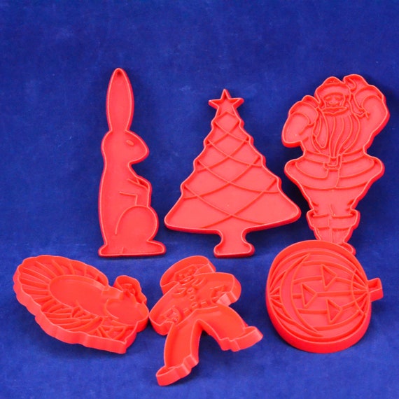 Tupperware red plastic holiday cookie cutters - vintage baking