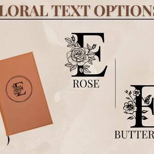 May include: A tan leather journal with a floral letter design. The journal has a black ribbon bookmark. The image also shows floral letter designs with the words "ROSE" and "BUTTERFLY". The text "FLORAL TEXT OPTIONS" is at the top.