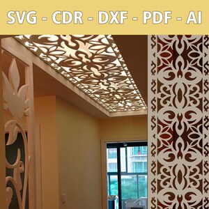 May include: A white ceiling panel with a decorative cut-out design. The panel is installed in a room with a window and a wall with a similar decorative panel.