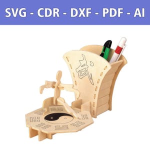 May include: A light-colored wooden desk organizer featuring a fan-shaped pen holder with a Chinese character, a figure in a martial arts pose, and an octagonal base with a yin-yang symbol and trigrams. Includes text SVG - CDR - DXF - PDF - AI.