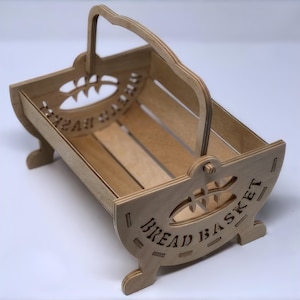 May include: A wooden bread basket with a handle and a cutout design that says "Bread Basket".