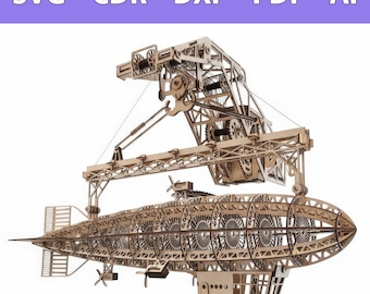 Op de afbeelding: Een lasergesneden houten model van een luchtschip dat aan een mechanische portaalkraan hangt. De complexe structuur toont zichtbare tandwielen, katrollen en propellers. De tekst SVG - CDR - DXF - PDF - AI staat bovenaan de afbeelding.