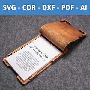 Puede incluir: Un archivador de madera con una página blanca que dice "Versatile Binder for A4 Documents". El archivador está diseñado para contener documentos, presentaciones e informes de tamaño A4.