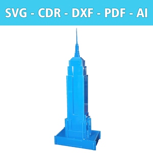 Könnte beinhalten: Ein blaues Modell des Empire State Building, ein berühmtes Hochhaus in New York City.