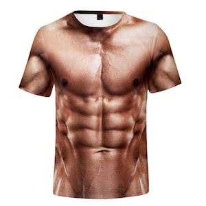 May include: A short-sleeved t-shirt featuring a photorealistic print of a muscular male torso. The design showcases detailed abs, chest muscles, and skin texture, creating a striking visual effect. The shirt has a crew neck and a standard fit.
