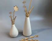 Cement vases. The pair,  one tall and one round. wood flowers included.  Industrial style decor