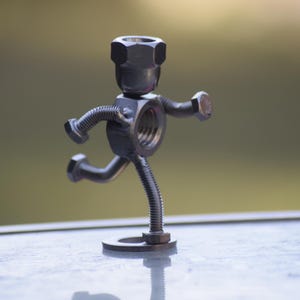 Sculpture Of A Runner Made Using Stainless Steel Nuts And Bolts Fitness Exercise