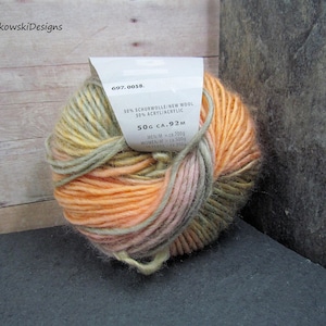 May include: A set of three ceramic mugs with a speckled, matte finish. The mugs are in shades of cream, light gray, and dark gray. Each mug has a simple, minimalist design, perfect for coffee or tea.