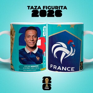May include: A white ceramic mug featuring Kylian Mbapp&eacute;, the French soccer player, with the text "TAZA FIGURITA 2026". The mug has a teal background with the French flag and FIFA logo. The mug is 182 cm tall and weighs 82 kg.