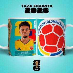 May include: A white ceramic mug with a teal background, featuring a soccer player and the text "TAZA FIGURITA 2026". The mug displays the Colombian Football Federation logo and a soccer ball design. The FIFA logo is also present.