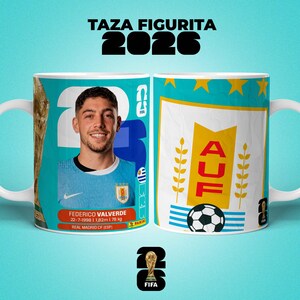 May include: White ceramic mug with a light blue background, featuring a soccer player, the text "TAZA FIGURITA 2026", and the FIFA logo. The mug displays the player's image and the AUF logo. The player's name, birthdate, height (1.82m) and weight (78 kg) are printed.