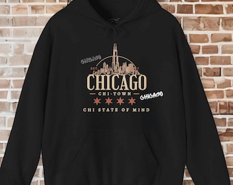 May include: A black hooded sweatshirt featuring a graphic print of the Chicago skyline. The design includes the text CHICAGO, CHI-TOWN, and CHI STATE OF MIND, along with four red stars. The hoodie has long sleeves, a front kangaroo pocket, and a hood.