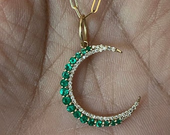 14 karat gold emerald and diamond crescent pendant