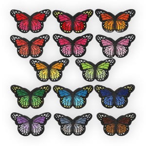 May include: Assortment of 15 colorful embroidered iron-on butterfly patches. The butterflies are in various colors, including red, orange, yellow, green, blue, purple, and brown.