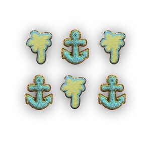 May include: Six iron-on patches, three are palm trees and three are anchors. The palm trees are yellow with a light blue outline. The anchors are light blue with a gold outline.