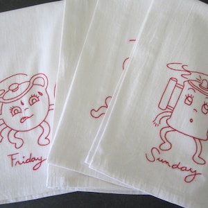 May include: Set of four white tea towels with red embroidered images of cartoon teapots with faces and the days of the week: Friday, Saturday, Sunday, and Monday.